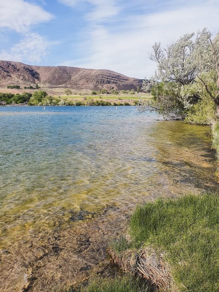 A shimmering blue lake at Sun Lakes Dry Falls State Park in eastern Washington.