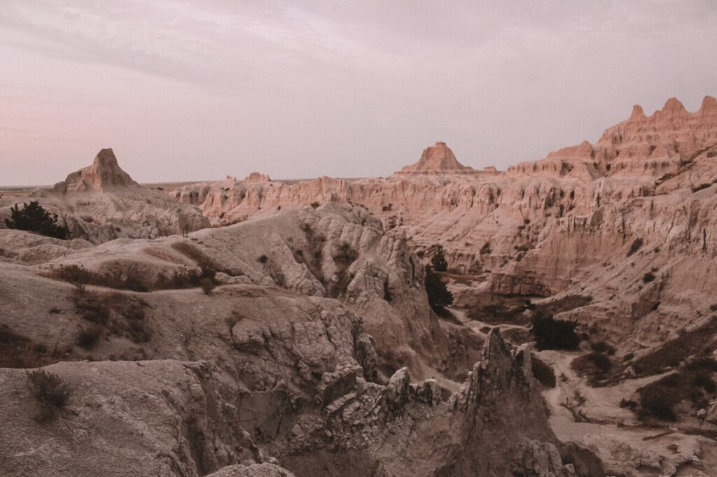 Hiking the Notch Trail at dusk, in Badlands National Park.