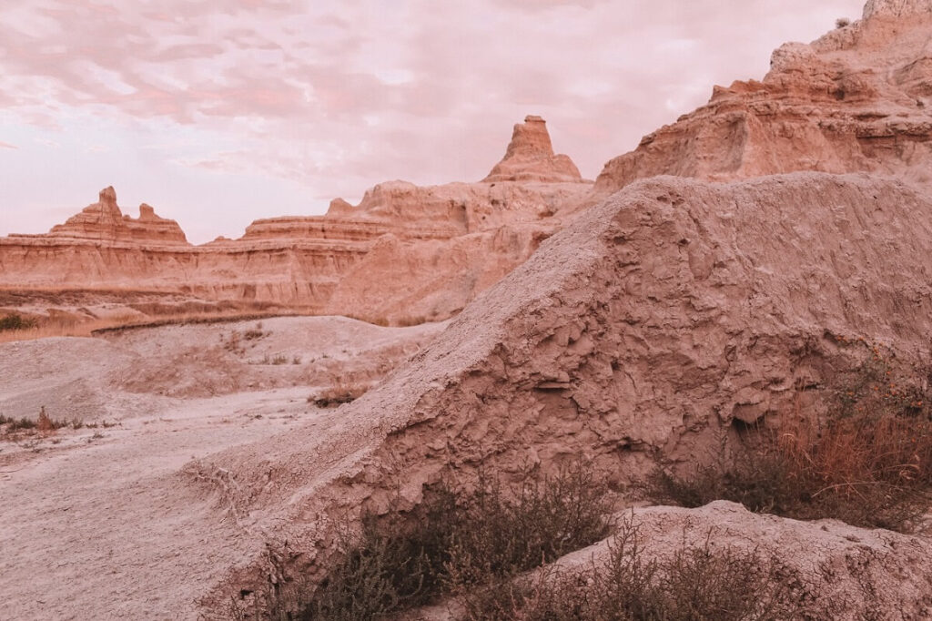 Hiking the Notch Trail at sunset in Badlands National Park.