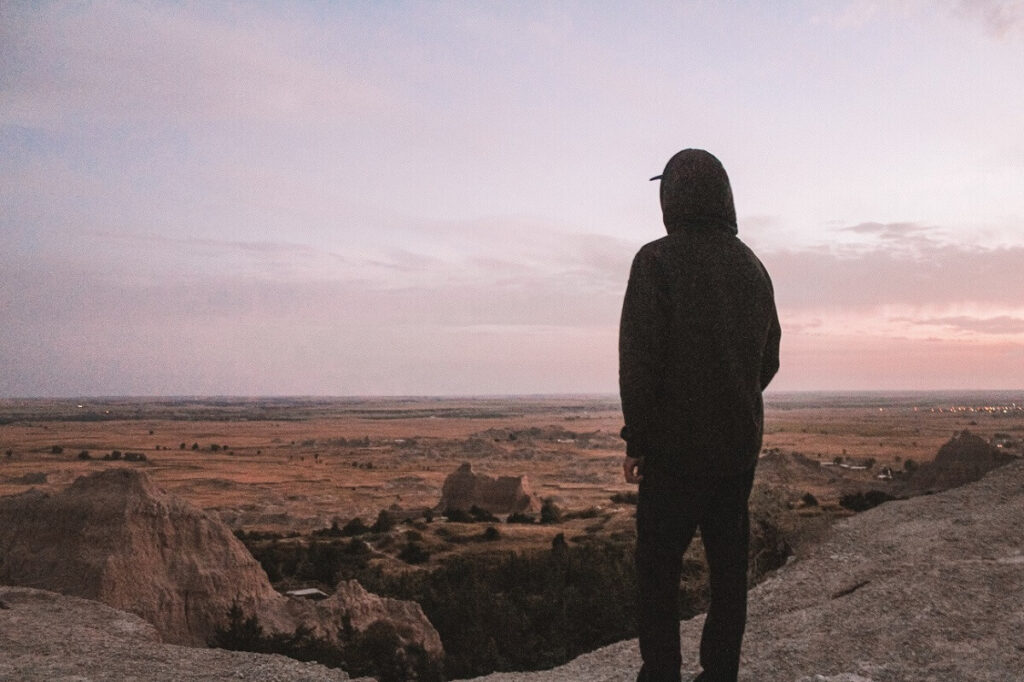 At the end of The Notch hiking trail overlooking a prairie during dusk.