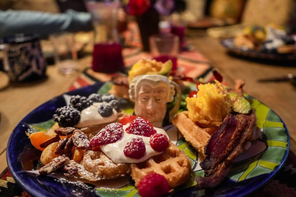 A delicious homemade breakfast featuring waffles and fresh fruit at Eve's Garden Bed & Breakfast in Marathon, Texas.