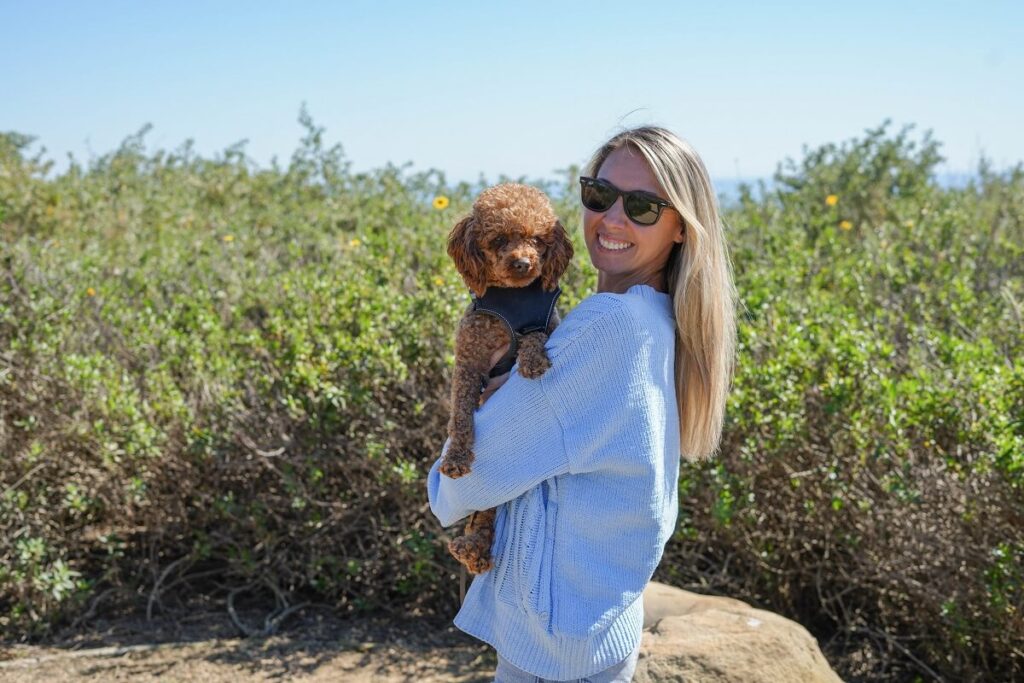 Arial Evans with her miniature red poodle Quincie.